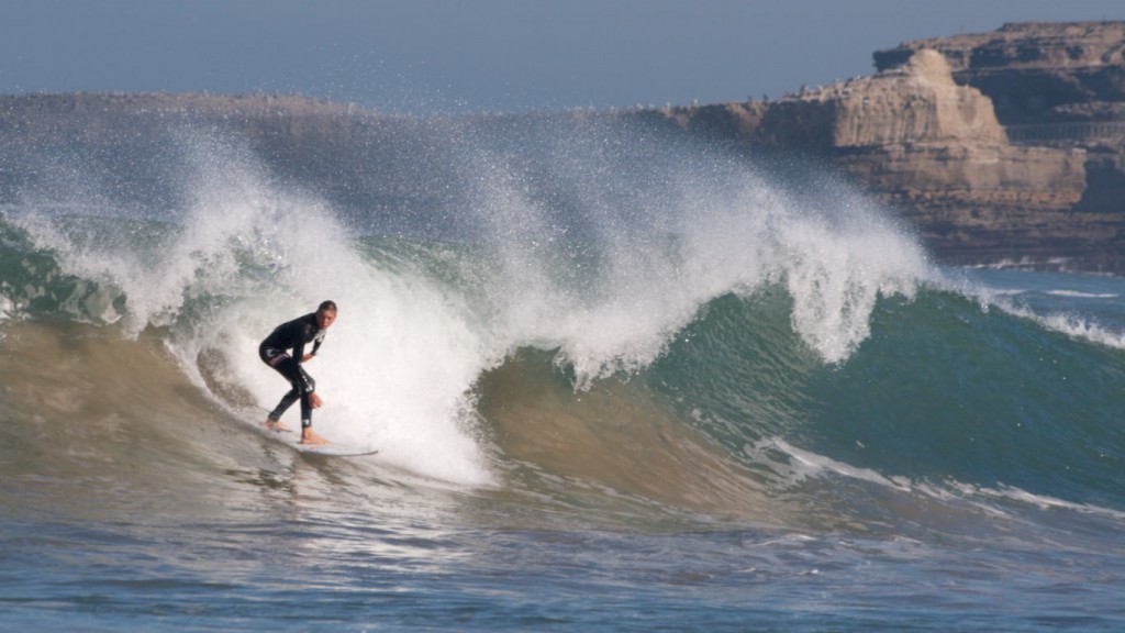 Surfer riding a wave in Biarritz